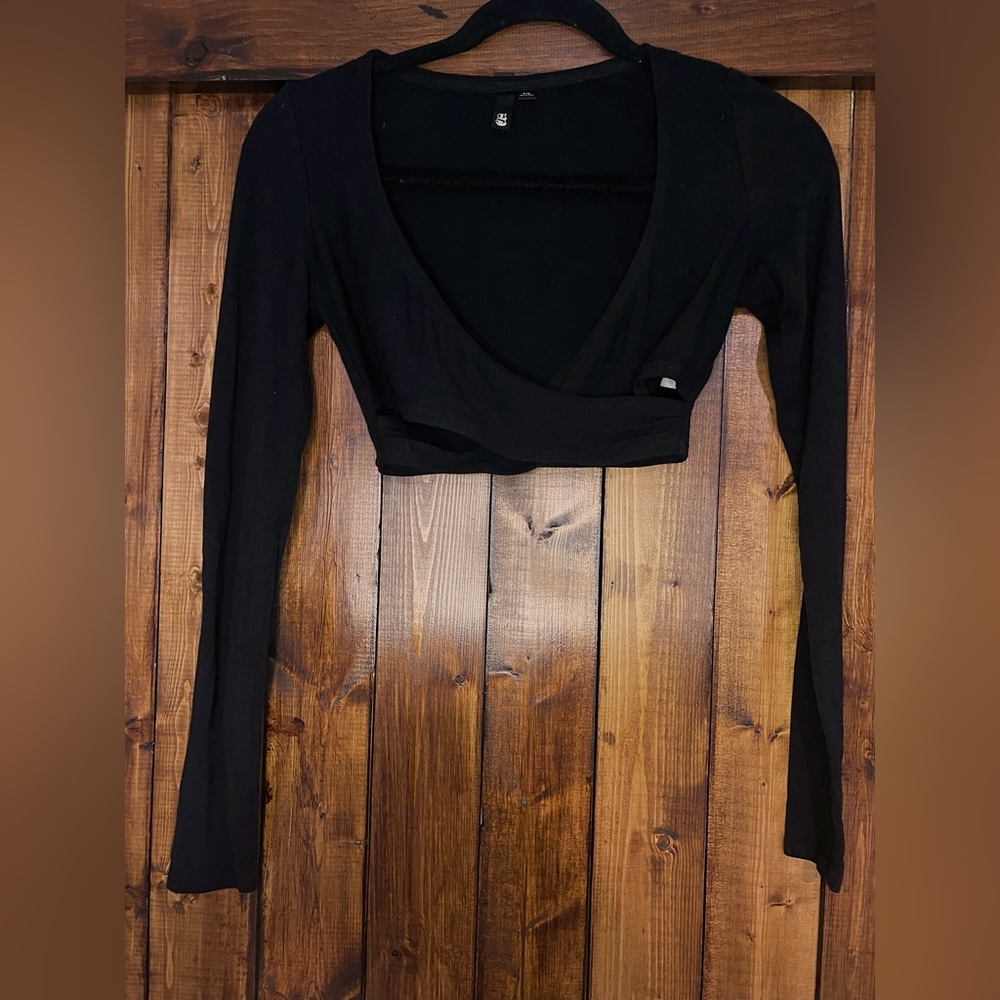 Garage, black long sleeve top that crosses in the front, small